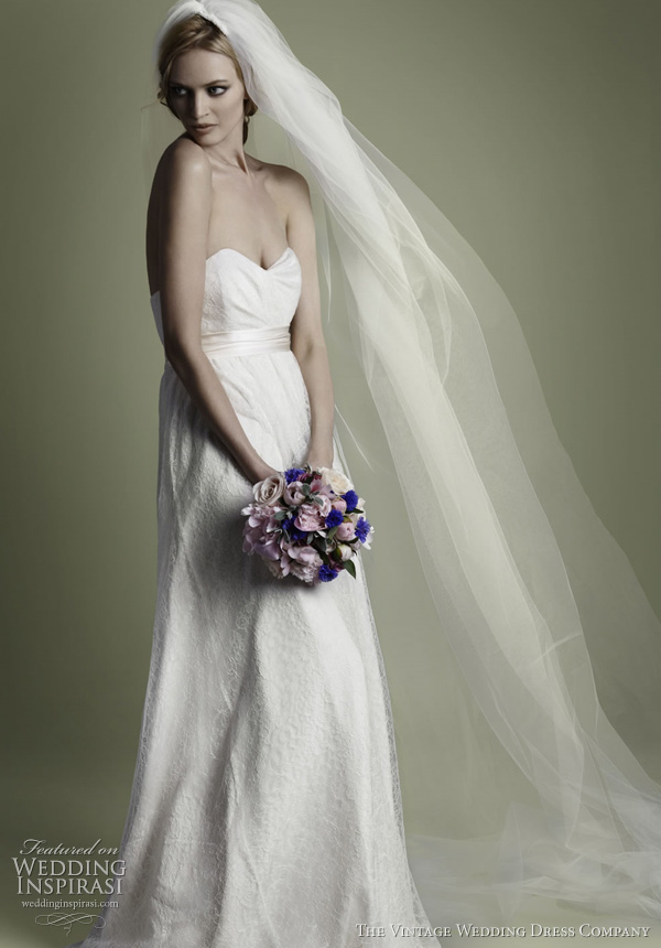 1950s wedding dresses - vintage 1950s' inspired bridal gown in a soft Chantilly lace, drapes and gathers over the silk crepe with corseted draped bodice, nipped waistline.