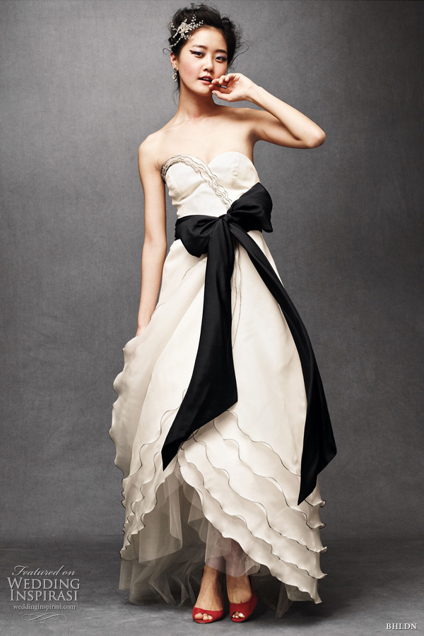 bhldn wedding - tiered tulip bridal gown in buttercream with black sash bhldn wedding - tiered tulip bridal gown in buttercream with black sash
