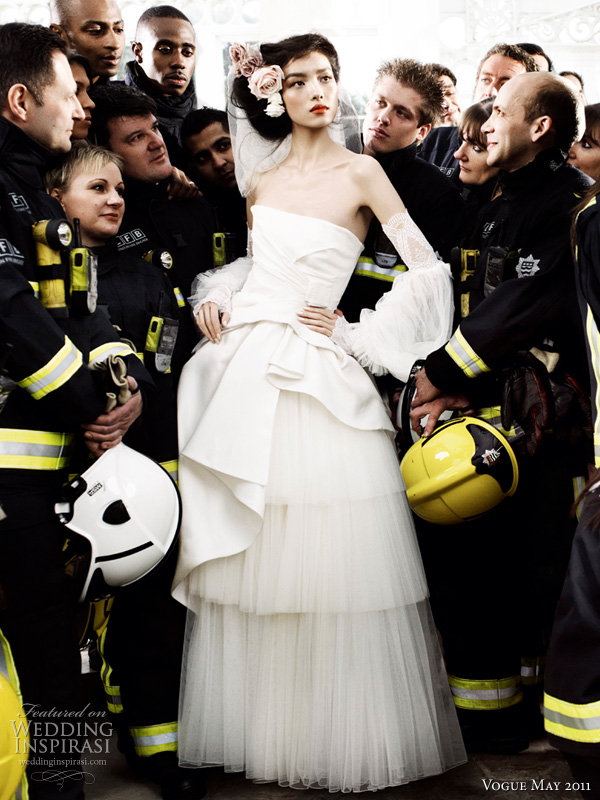 alberta ferreti wedding dress vogue - model Sun Fei Fei in silk radzimir and tulle Alberta Ferreti wedding dress surrounded by London firefighters shot by photographer Mario Testino for British Vogue Royal Wedding Issue May 2011