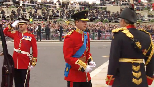 Prince William in Scarlet Irish Guard uniform,  blue Garter sash and star, Royal Air Force "wings" and Golden Jubilee medal, arrives at westminster abbey for the royal wedding ceremony 