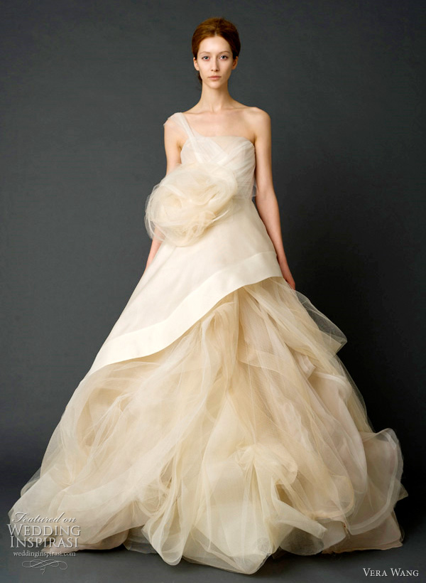 vera wang bridal spring 2012 - Sand one-shoulder gazar and French tulle ballgown with asymmetrical peplum bodice and draped skirt with tulle petal detail and horsehair and tulle corsage.