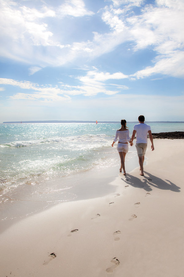 weddings by funjet concierge couple walking beach destination wedding