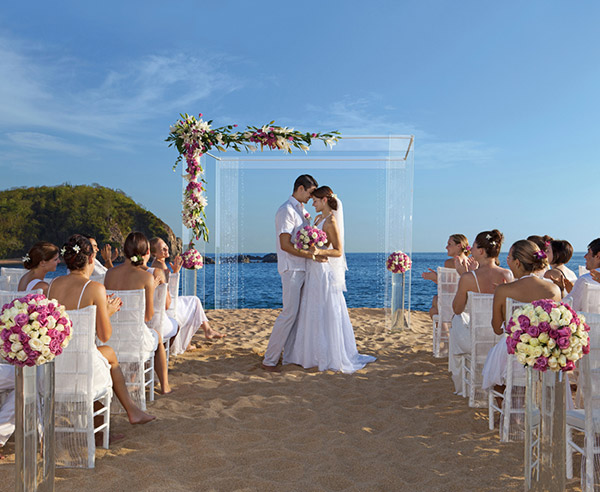 secrets resorts spas huatulco mexico wedding couple on sandy beach modern gazebo overlooking pacific