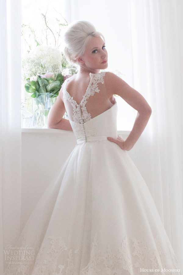house of mooshki bridal 2016 nora sleeveless calf tea length 1950s wedding dress illusion neckline lace hem detail back view close up house of mooshki bridal 2016 nora sleeveless calf tea length 1950s wedding dress illusion neckline lace hem detail back view close up