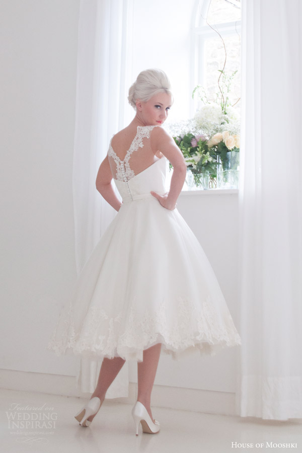 house of mooshki bridal 2016 nora sleeveless calf tea length 1950s wedding dress illusion neckline lace hem detail back view house of mooshki bridal 2016 nora sleeveless calf tea length 1950s wedding dress illusion neckline lace hem detail back view