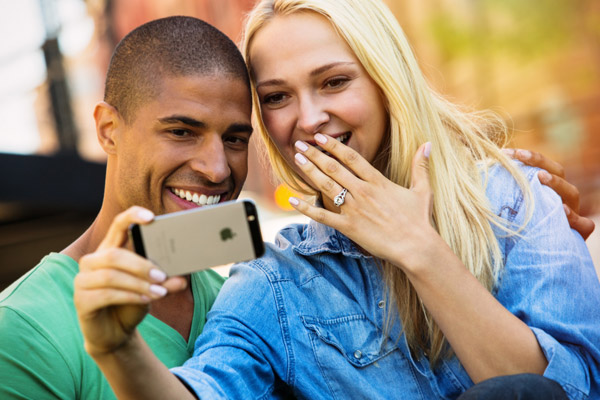 jewelers mutual insurance company just engaged couple ring selfie