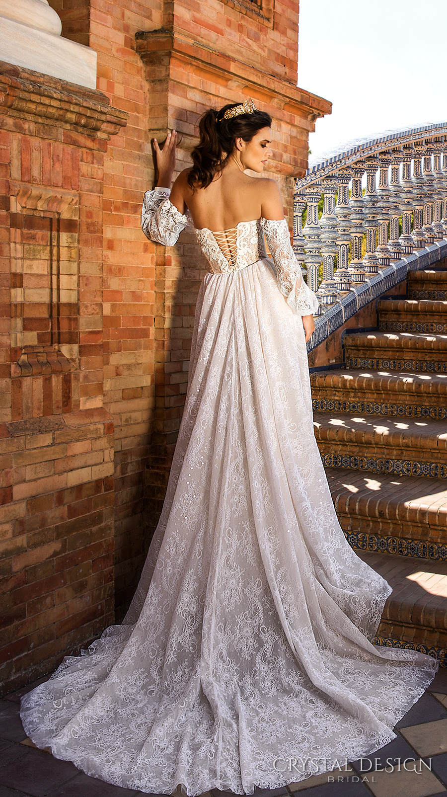 https://www.weddinginspirasi.com/wp-content/uploads/2016/12/crystal-design-2017-bridal-long-bishop-sleeves-sweetheart-neckline-heavily-embellished-bodice-elegant-lace-sheath-wedding-dress-a-line-overskirt-corset-back-chapel-train-camilla-bv-.jpg