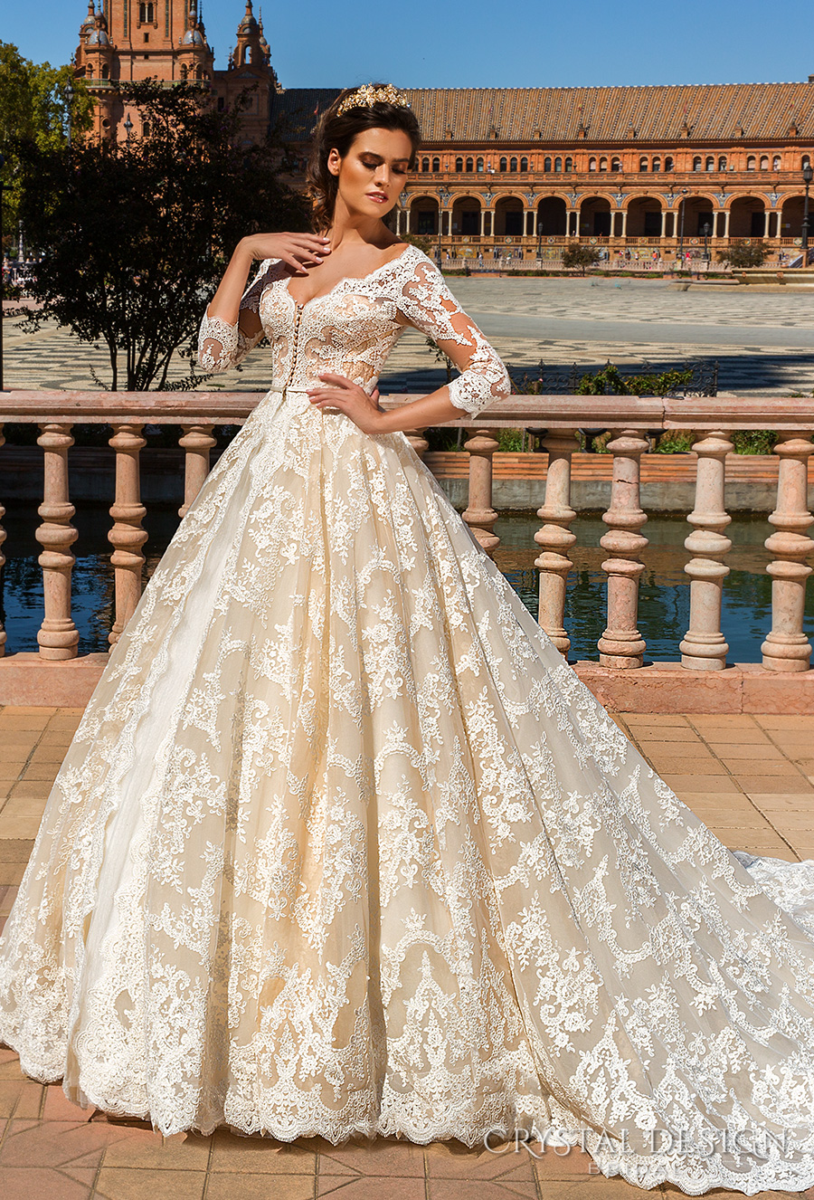 https://www.weddinginspirasi.com/wp-content/uploads/2016/12/crystal-design-2017-bridal-three-quarter-sleeves-v-neck-full-embellishment-ivory-color-princess-ball-gown-a-line-wedding-dress-monarch-train-amelia-mv.jpg