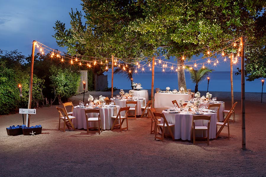 apple vacations jamaica destination wedding couples resorts negril beach night charming string light decor