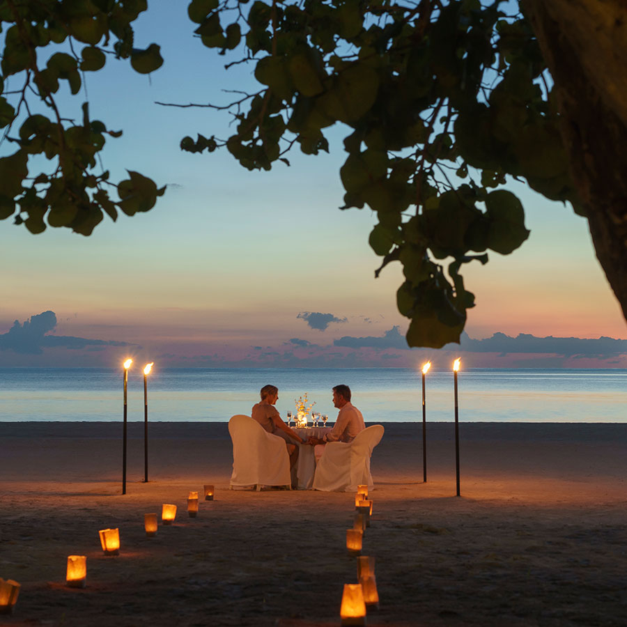 apple vacations romantic canlde lit dinner on the beach couples resorts