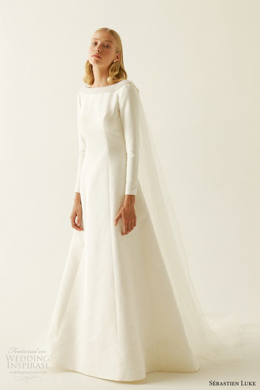 sebastien luke fall 2019 bridal jewel neckline long sleeves minimal embellishment modified a line wedding dress pockets cape clean simple modern (4) mv