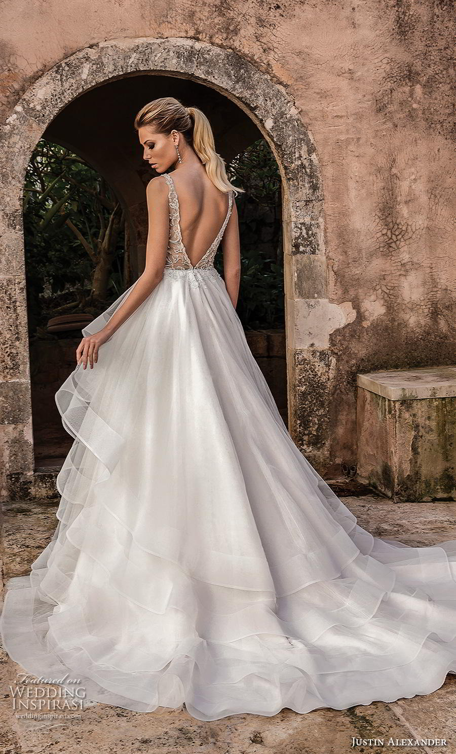 justin alexander spring 2019 bridal sleeveless with strap deep plunging v neck heavily embellished bodice tiered skirt romantic a  line wedding dress backless v back chapel train (6) bv 