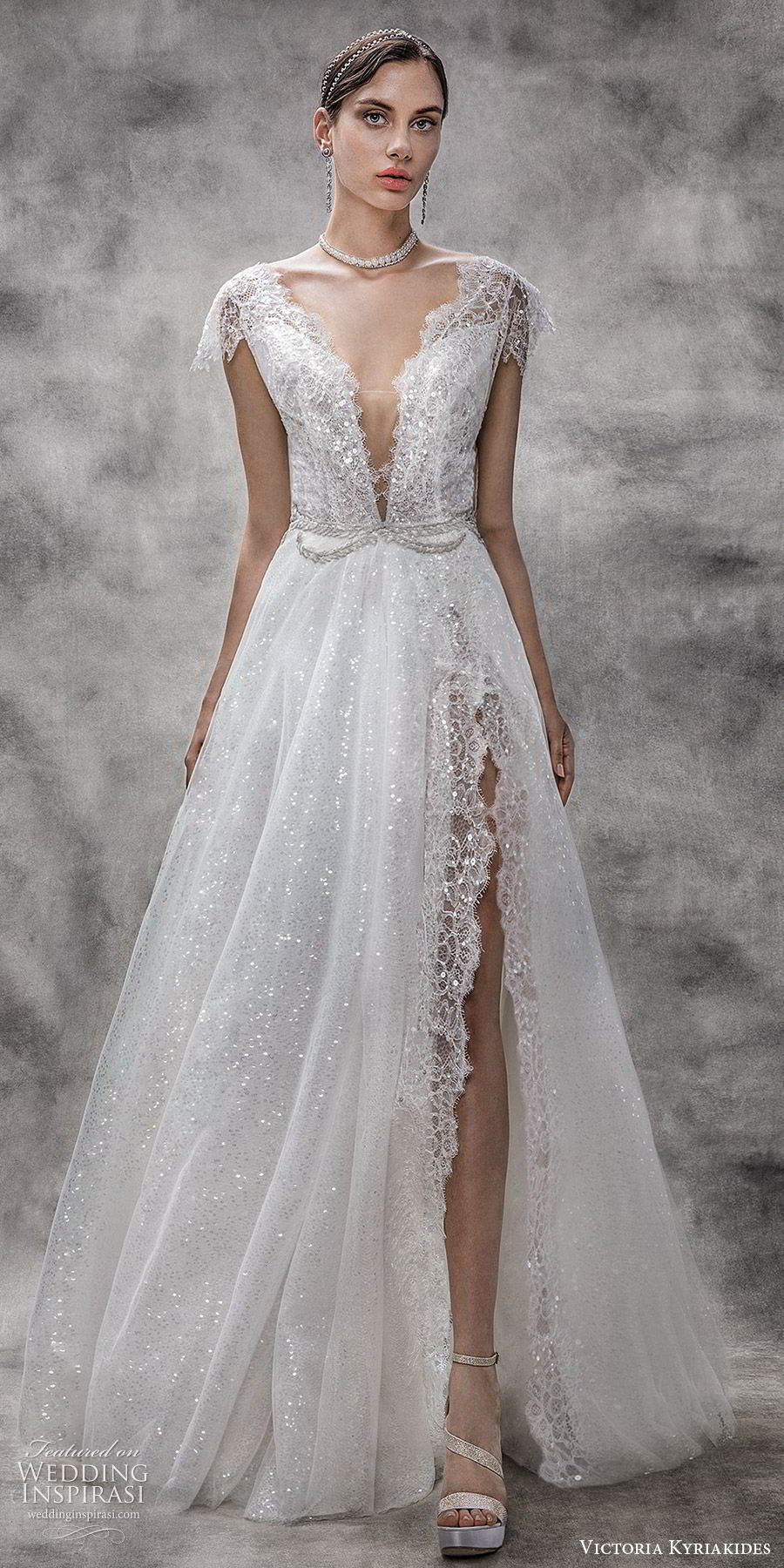 victoria kyriakides spring 2020 bridal illusion flutter sleeves deep v neckline fully embellished lace a line ball gown wedding dress (10) chapel train slit skirt glitzy romantic mv