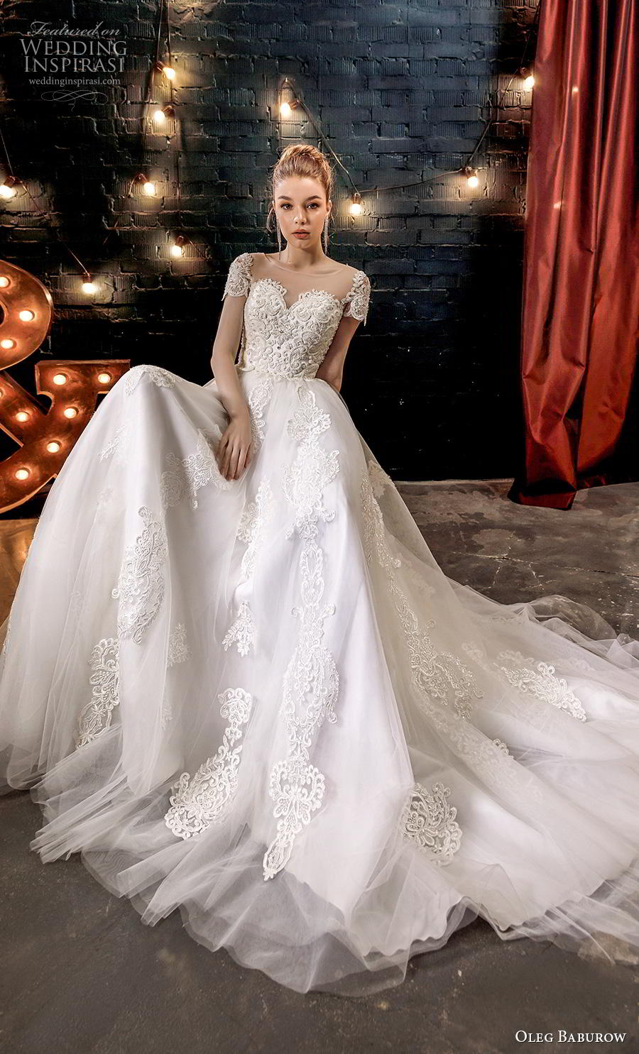 oleg baburow 2020 star girl bridal short sleeves illusion bateau sweetheart neckline heavily embellished bodice ball gown wedding dress sheer button back chapel train (9) mv