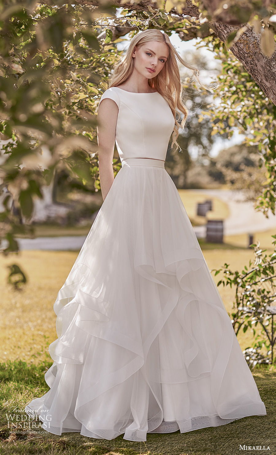 mikaella spring 2020 bridal cap sleeves bateau simple minimalist tiered skirt classic modest a line wedding dress covered back sweep train (9) mv mikaella spring 2020 bridal cap sleeves bateau simple minimalist tiered skirt classic modest a line wedding dress covered back sweep train (9) mv
