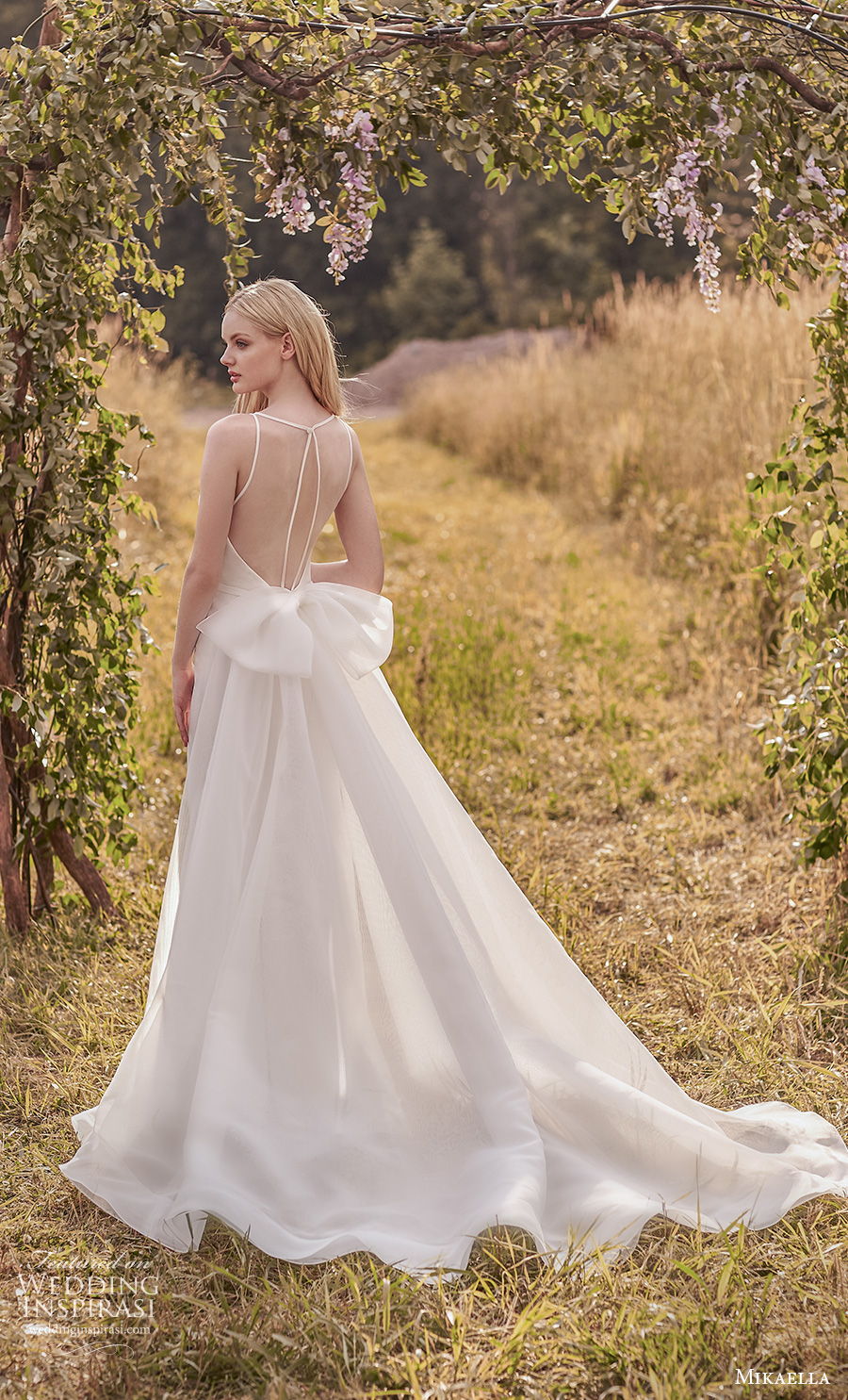 mikaella spring 2020 bridal sleeveless illusion bateau sweetheart neckline simple minimalist elegant fit and flare wedding dress a line overskirt sheer keyhole back chapel train (1) bv mikaella spring 2020 bridal sleeveless illusion bateau sweetheart neckline simple minimalist elegant fit and flare wedding dress a line overskirt sheer keyhole back chapel train (1) bv