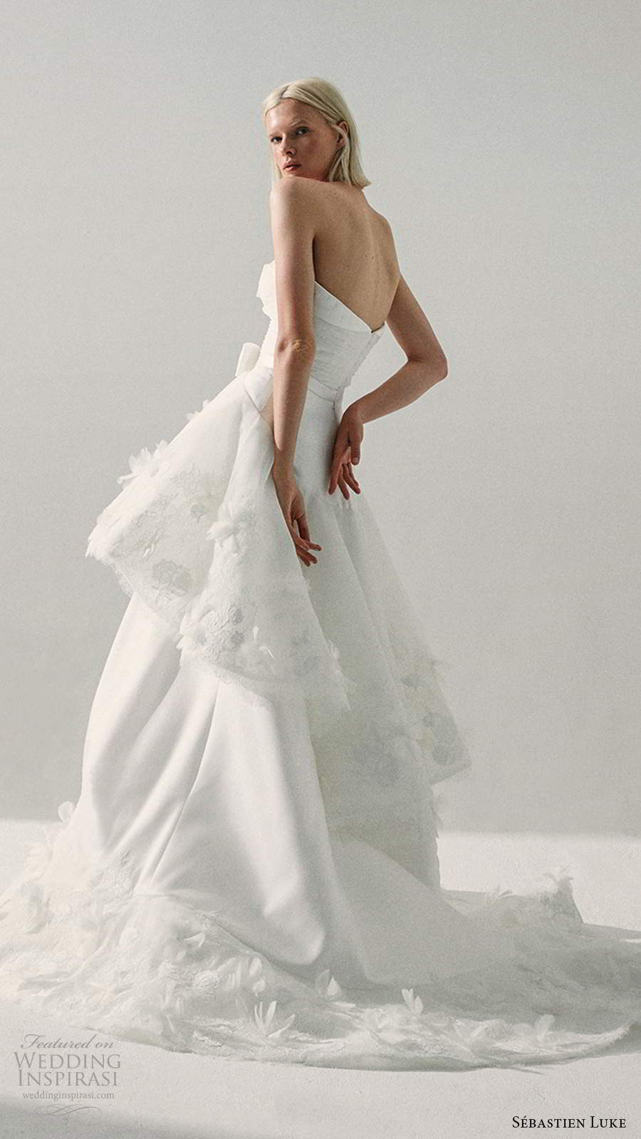 sebastien luke fall 2020 bridal strapless semi sweetheart neckline ruched bodice a line ball gown wedding dress tiered skirt (2) bv