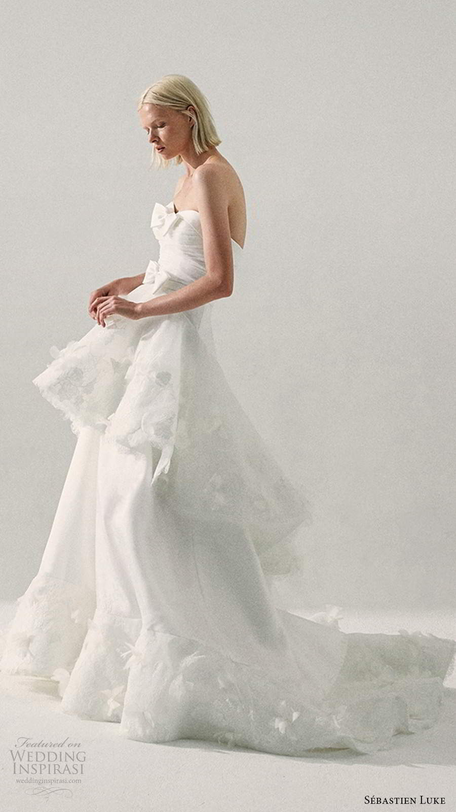 sebastien luke fall 2020 bridal strapless semi sweetheart neckline ruched bodice a line ball gown wedding dress tiered skirt (2) sv