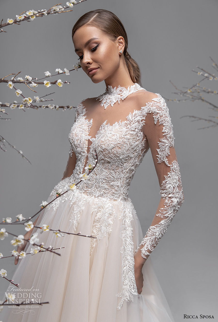 ricca sposa spring 2021 bridal long sleeves illusion high neck v neck heavily embellished bodice romantic blush a  line wedding dress sheer button back chapel train (13) zv