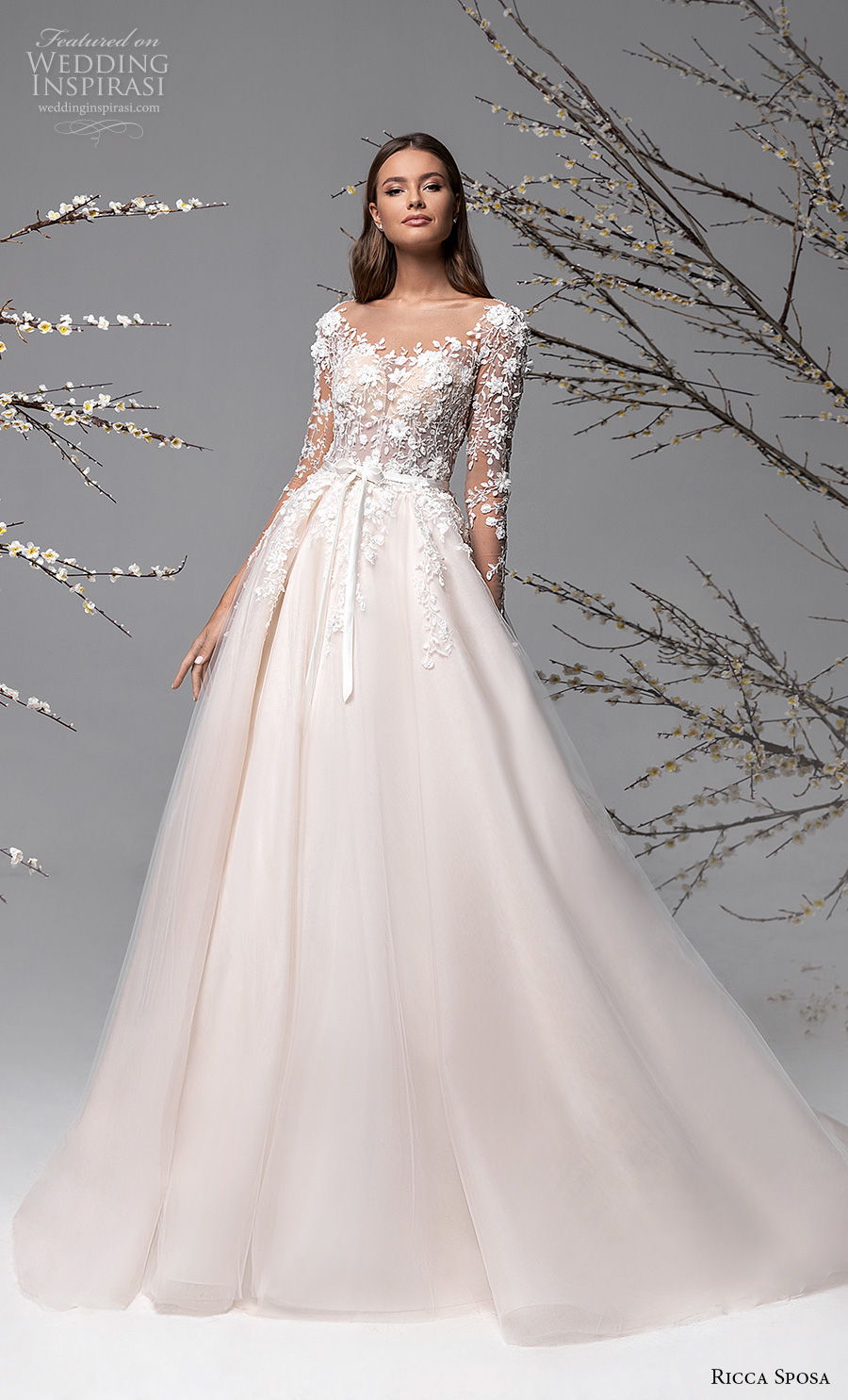 ricca sposa spring 2021 bridal long sleeves illusion scoop sweetheart neckline heavily embellished bodice romantic champagne a  line wedding dress sheer button back chapel train (1) mv
