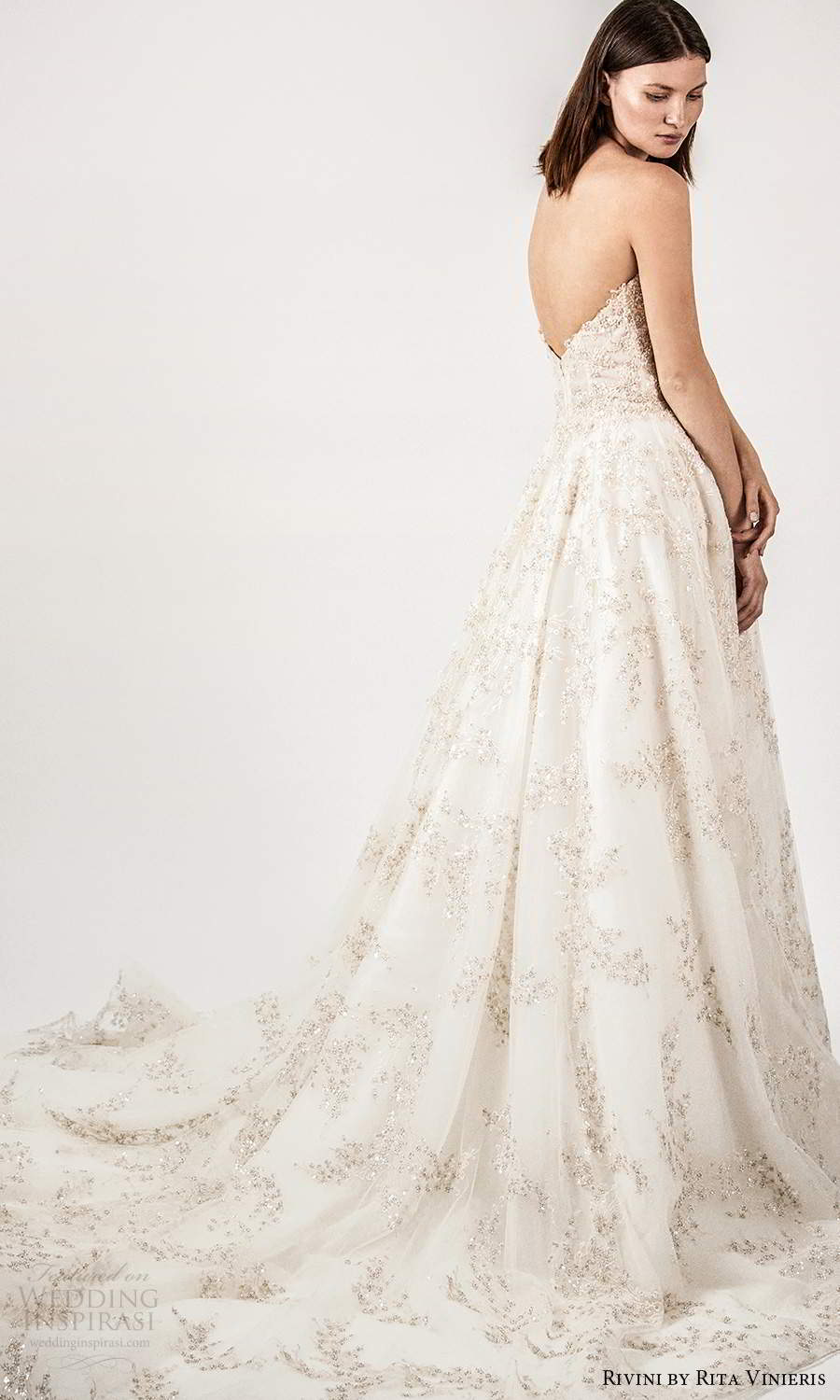 rivini rita vinieris spring 2021 bridal strapless straight across split neckline fully embellished a line ball gown wedding dress champagne chapel train (4) bv rivini rita vinieris spring 2021 bridal strapless straight across split neckline fully embellished a line ball gown wedding dress champagne chapel train (4) bv