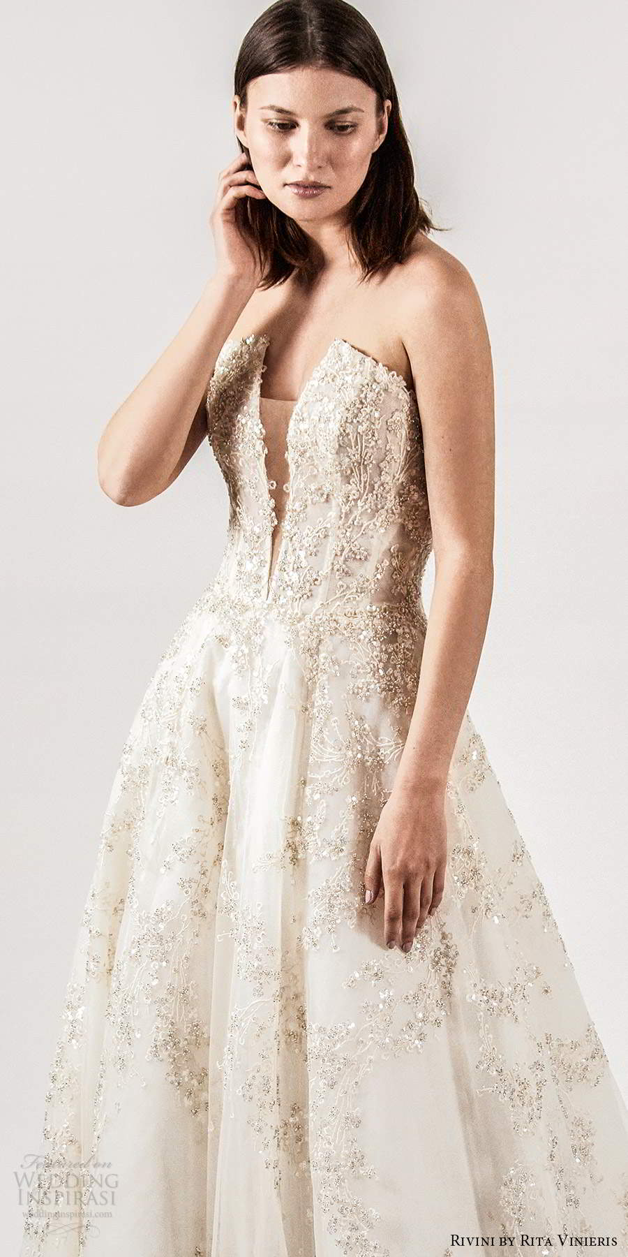 rivini rita vinieris spring 2021 bridal strapless straight across split neckline fully embellished a line ball gown wedding dress champagne chapel train (4) lv rivini rita vinieris spring 2021 bridal strapless straight across split neckline fully embellished a line ball gown wedding dress champagne chapel train (4) lv