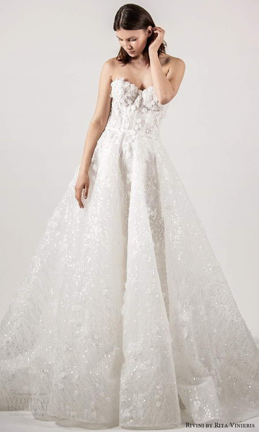 rivini rita vinieris spring 2021 bridal strapless sweetheart neckline fully embellished a line ball gown wedding dress chapel train (6) mv rivini rita vinieris spring 2021 bridal strapless sweetheart neckline fully embellished a line ball gown wedding dress chapel train (6) mv