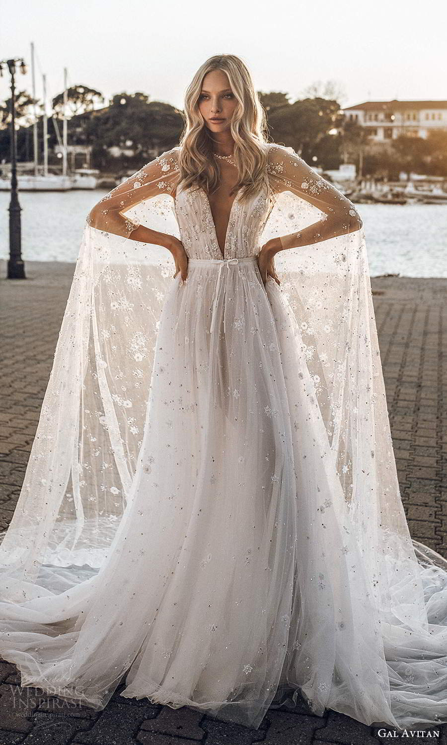 gal avitan 2021 bridal sleeveless straps plunging v neckline ruched bodice fully embellished a line wedding dress sheer cape chapel train (5) mv gal avitan 2021 bridal sleeveless straps plunging v neckline ruched bodice fully embellished a line wedding dress sheer cape chapel train (5) mv