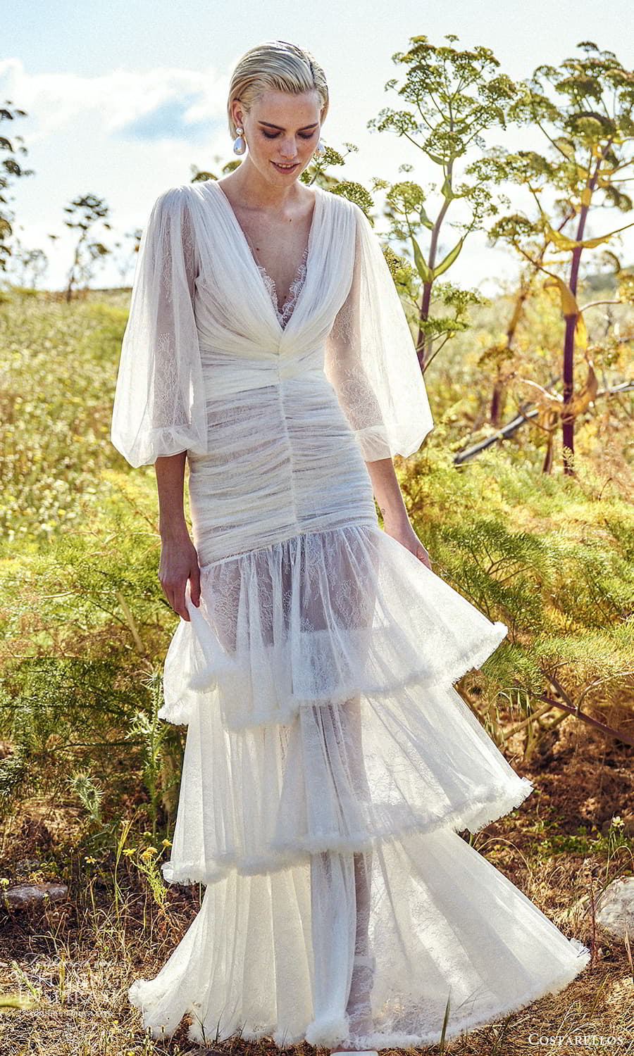 costarellos spring 2022 bridal 3 quarter puff sleeves plunging v neckline ruched bodice column wedding dress tiered skirt (19) mv costarellos spring 2022 bridal 3 quarter puff sleeves plunging v neckline ruched bodice column wedding dress tiered skirt (19) mv