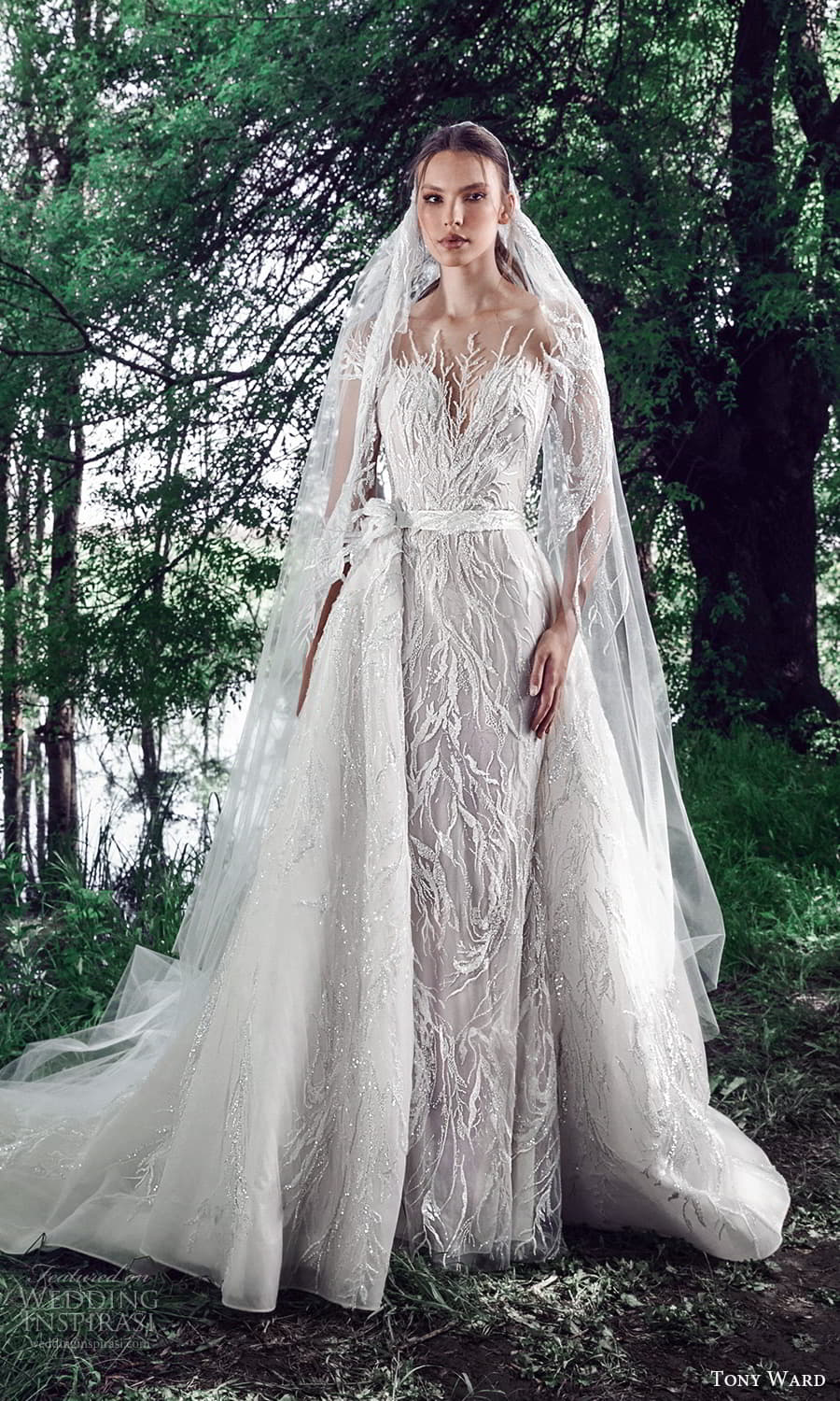 tony ward spring 2022 bridal sheer short sleeves illusion bateau neckline sweetheart neckline fully embellished sheath wedding dress chapel train a line overskirt (2) mv