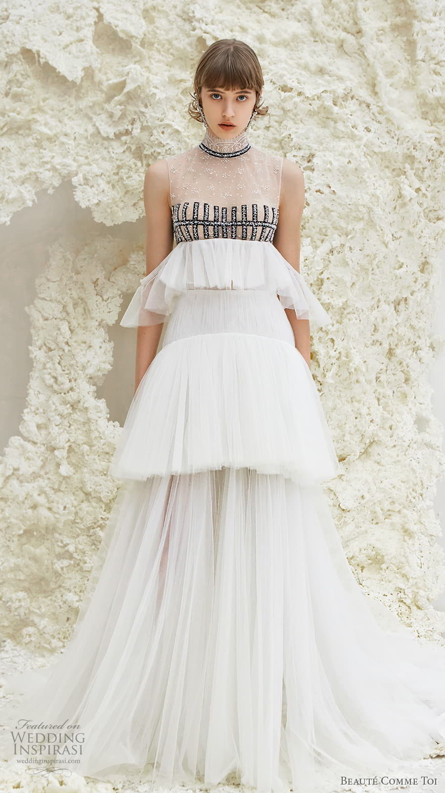 beaute comme toi spring 2022 bridal sleeveless high neck lightly embellished bodice empire a line wedding dress sheer button back tiered skirt sweep train (faye) mv