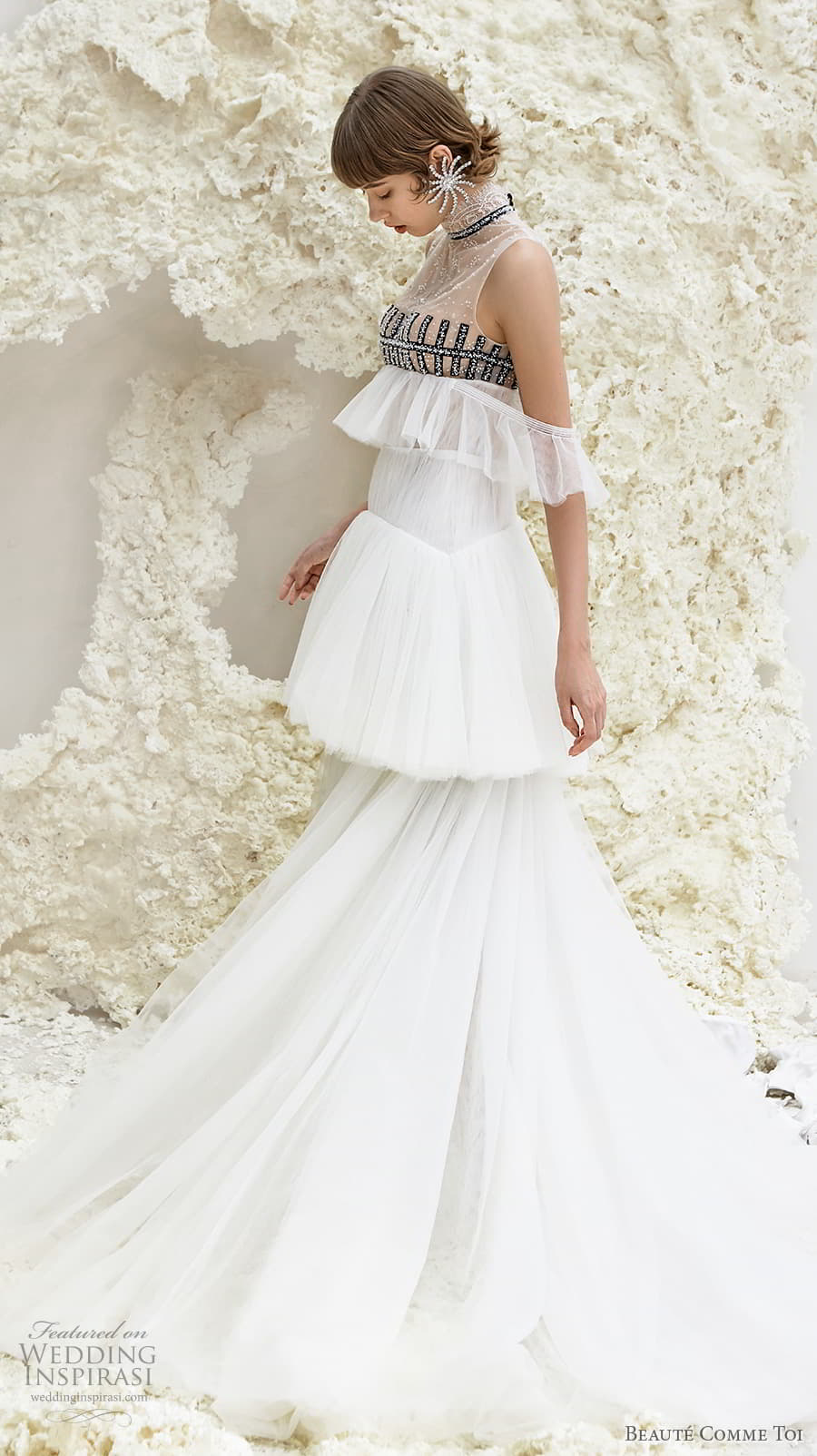 beaute comme toi spring 2022 bridal sleeveless high neck lightly embellished bodice empire a line wedding dress sheer button back tiered skirt sweep train (faye) sv