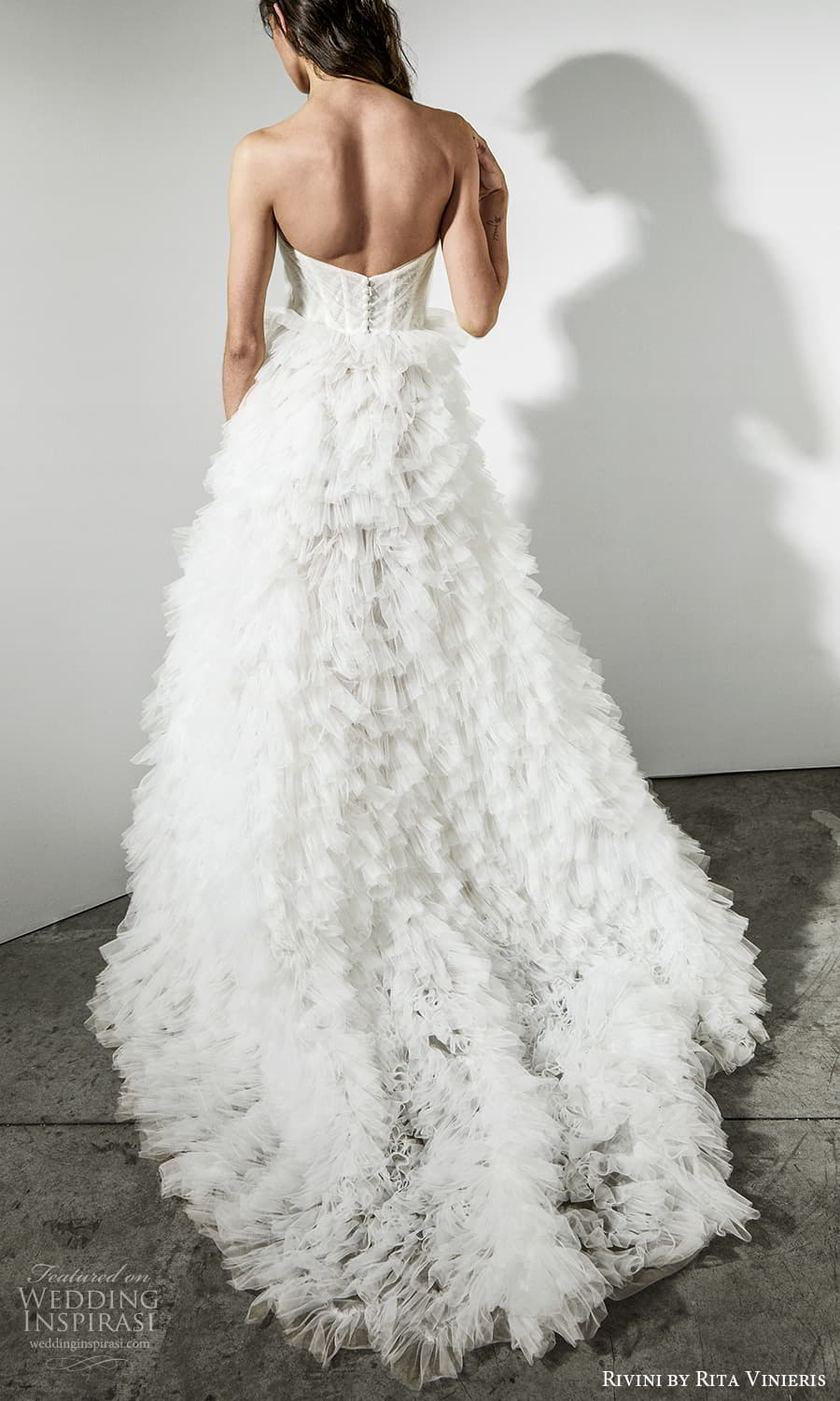rivini rita vinieris spring 2022 bridal strapless sweetheart neckline ruched bodice ruffle skirt a line wedding dress chapel train (1) bv rivini rita vinieris spring 2022 bridal strapless sweetheart neckline ruched bodice ruffle skirt a line wedding dress chapel train (1) bv