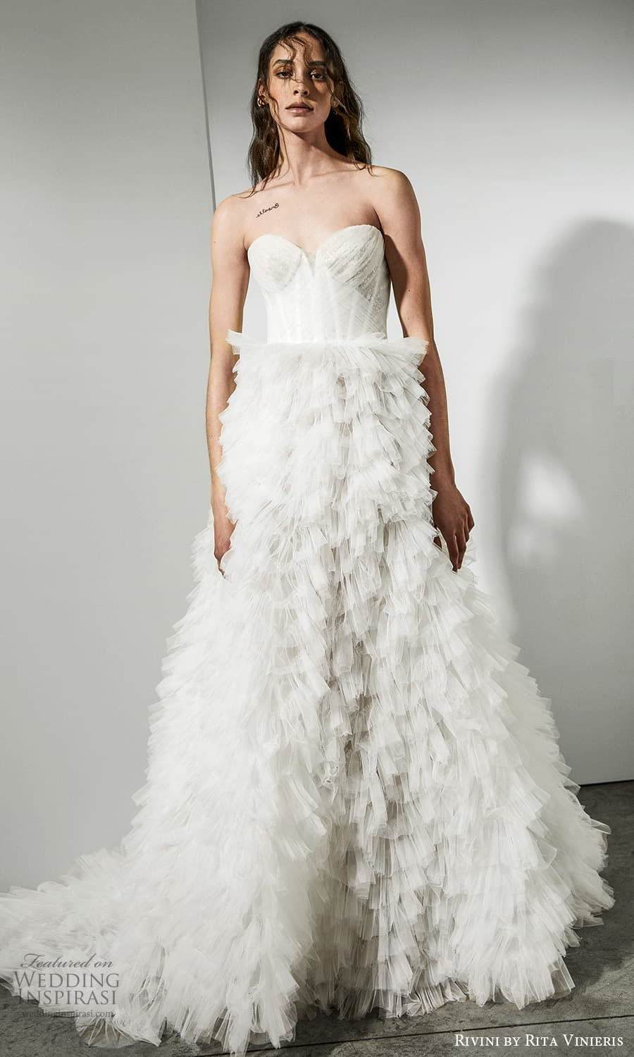 rivini rita vinieris spring 2022 bridal strapless sweetheart neckline ruched bodice ruffle skirt a line wedding dress chapel train (1) mv rivini rita vinieris spring 2022 bridal strapless sweetheart neckline ruched bodice ruffle skirt a line wedding dress chapel train (1) mv