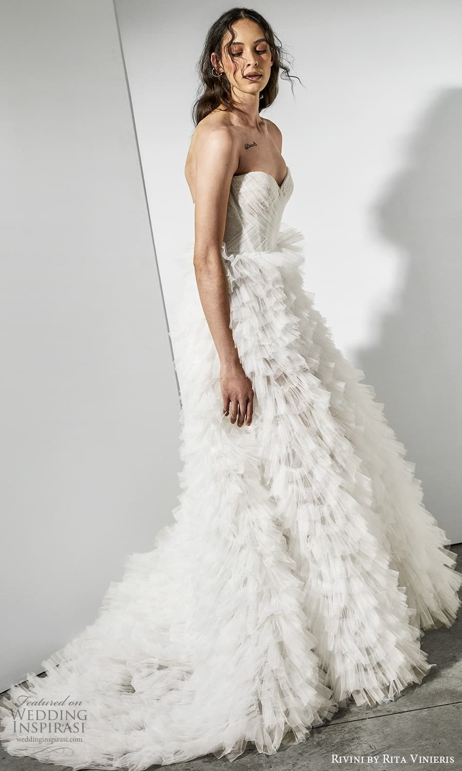 rivini rita vinieris spring 2022 bridal strapless sweetheart neckline ruched bodice ruffle skirt a line wedding dress chapel train (1) sv rivini rita vinieris spring 2022 bridal strapless sweetheart neckline ruched bodice ruffle skirt a line wedding dress chapel train (1) sv