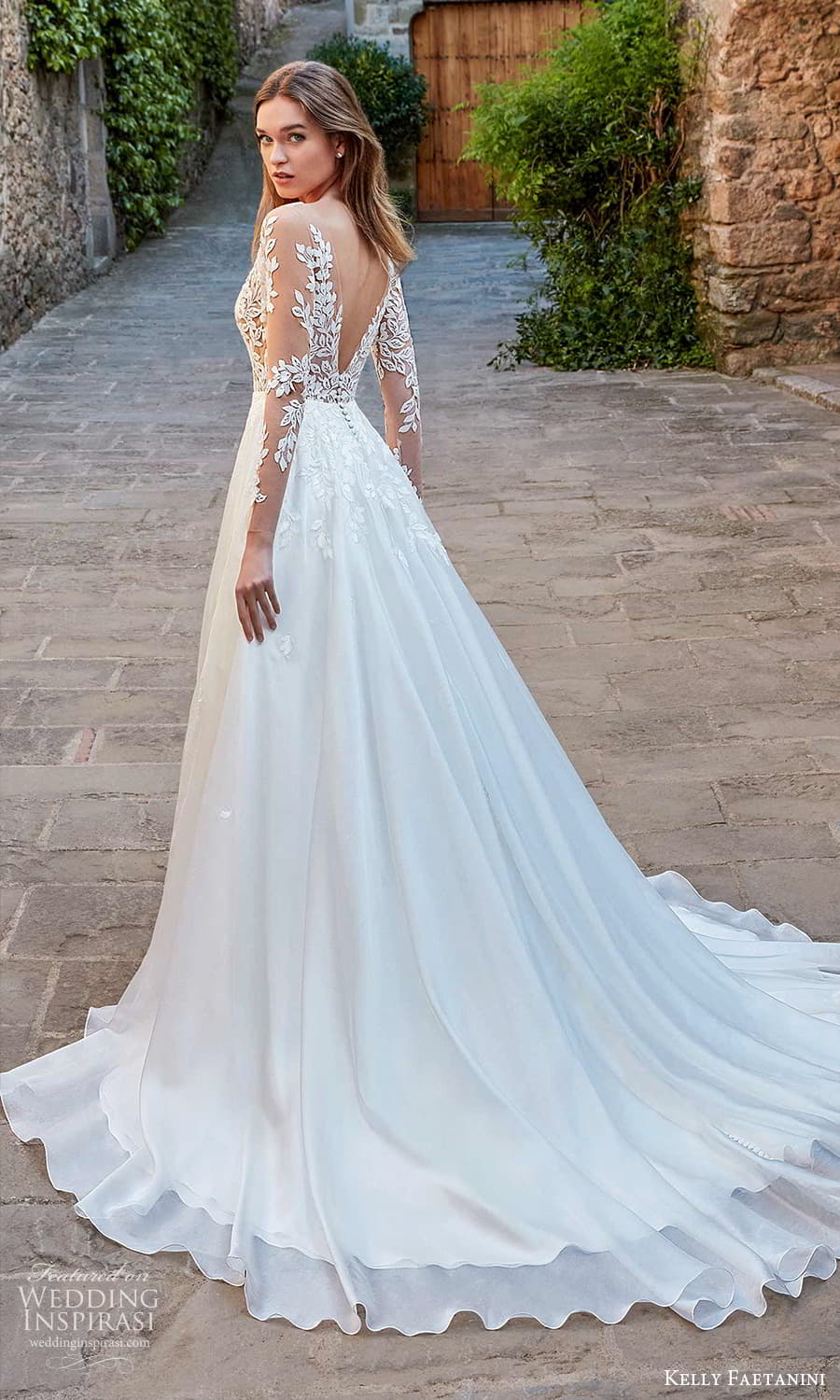 kelly faetanini spring 2022 campaign bridal sheer long sleeve plunging v neckline embellished lace a line ball gown wedding dress chapel train (19) bv