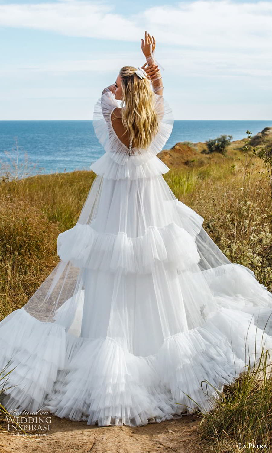 la petra 2021 bridal sheer long sleeve flutter illusion jewel neckline tiered skirt a line ball gown wedding dress chapel train (8) bv