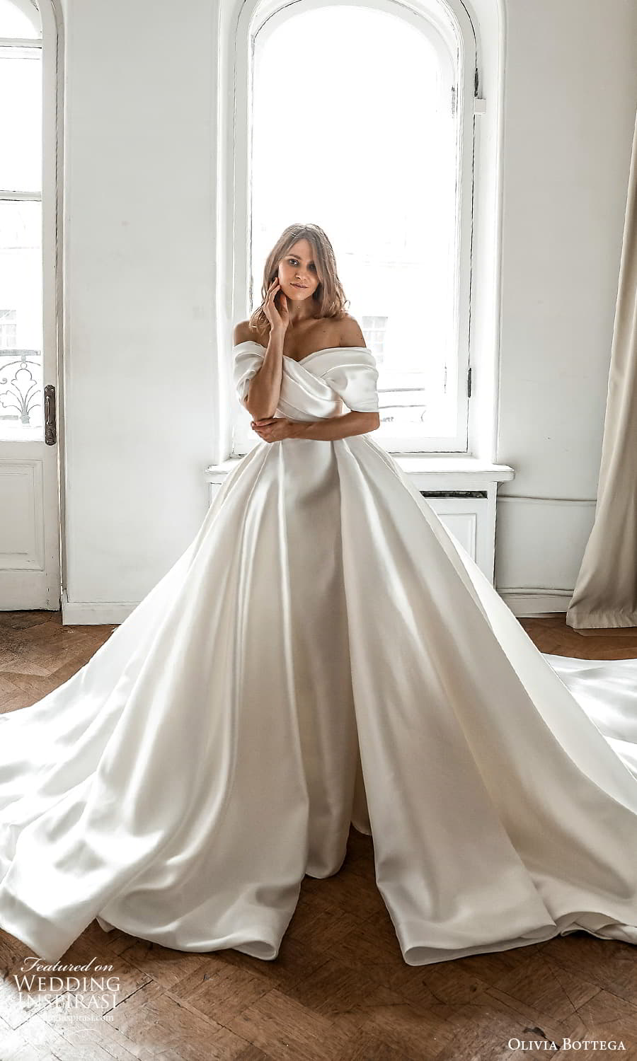 olivia bottega 2022 capsule bridal elbow length sleeve off shoulder neckline ruched bodice clean minimalist sheath wedding dress a line overskirt cathedral chapel train (7) fv