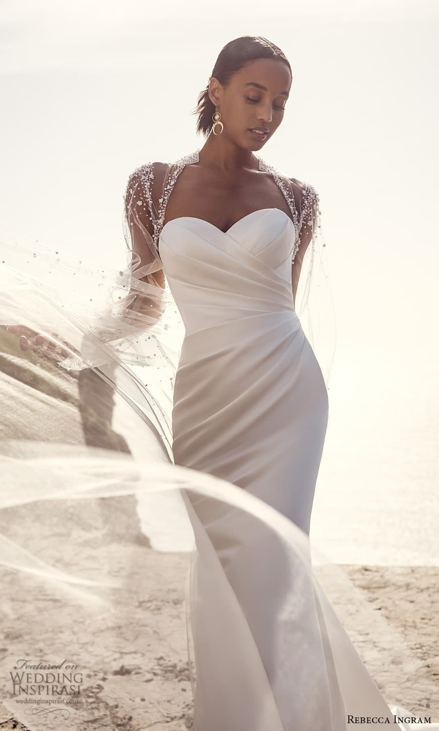 rebecca ingram spring 2023 bridal sheer long sleeve sweetheart neckline modern sheath wedding dress chapel train mv