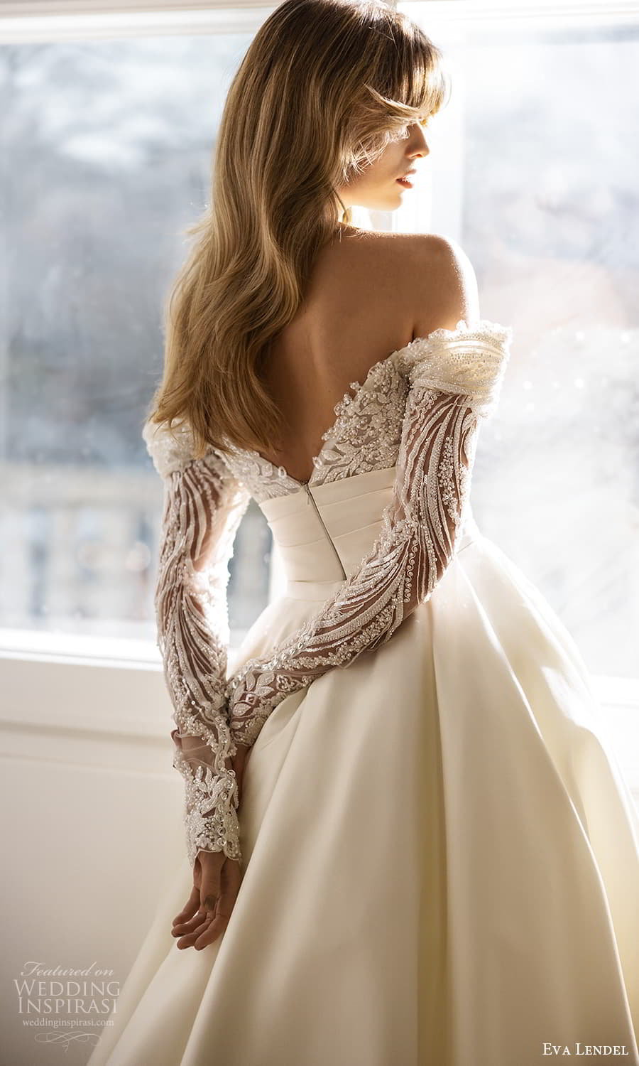 eva lendel fall 2023 bridal sheer long sleeve off shoulder sweetheart neckline heavily embellished bodice clean skirt sheath wedding dress a line overskirt chapel train (14) zbv eva lendel fall 2023 bridal sheer long sleeve off shoulder sweetheart neckline heavily embellished bodice clean skirt sheath wedding dress a line overskirt chapel train (14) zbv
