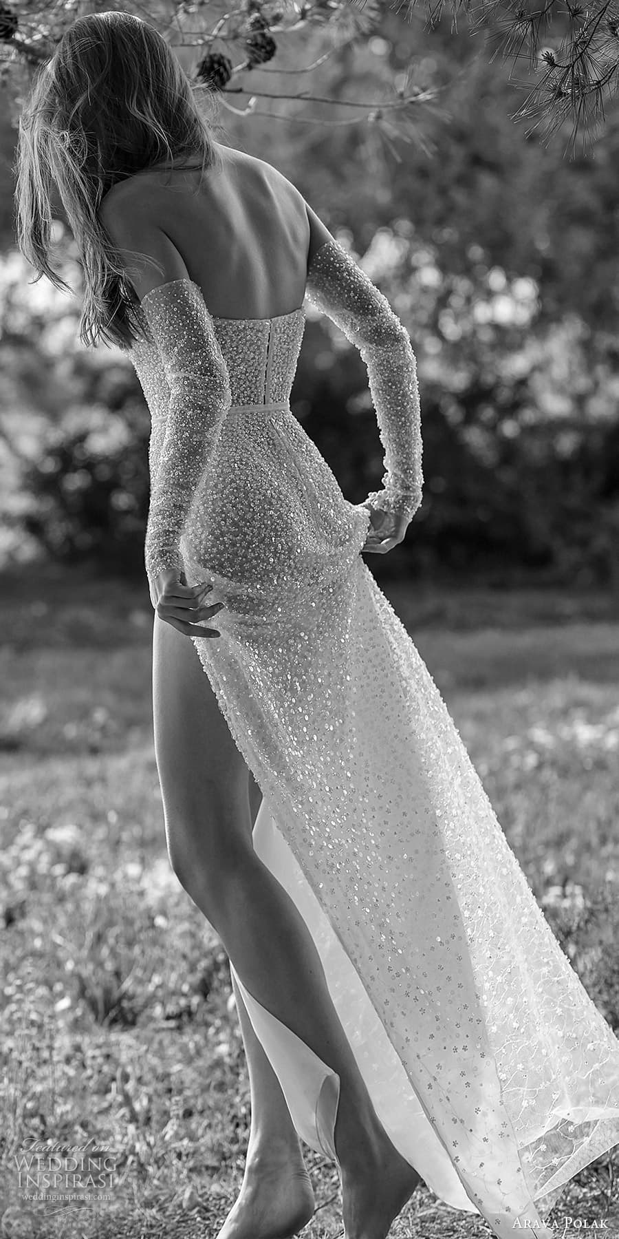arava polak spring 2024 bridal detached long sleeve strapless sharp sweetheart neckline fully embellished sheath wedding dress chapel train slit skirt (1) bv