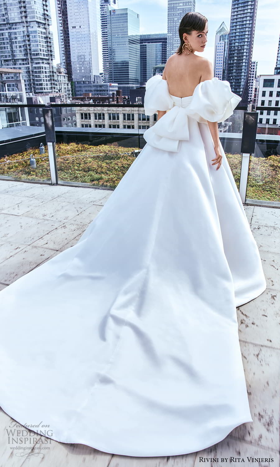 rivini rita vinieris fall 2024 bridal detached short puff sleeve strapless straight across neckline clean minimalist a line ball gown wedding dress slit skirt chapel train (7) bv