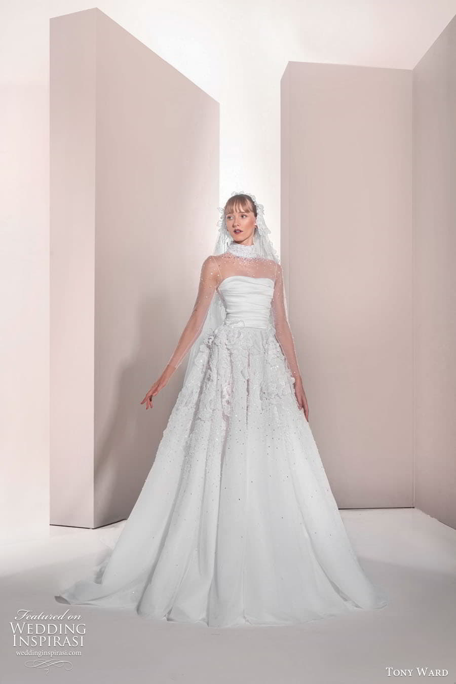 tony ward spring 2025 bridal sheer long sleeves illusion high neck semi sweetheart neckline ruched bodice embellished skirt a line ball gown wedding dress chapel train datura 02 mv